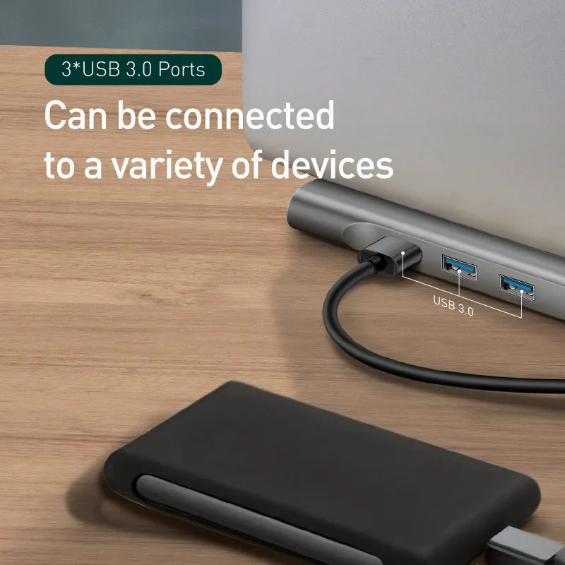 Grey aluminium USB C hub docking station with cooling bracket showing ten ports including HDMI and Ethernet