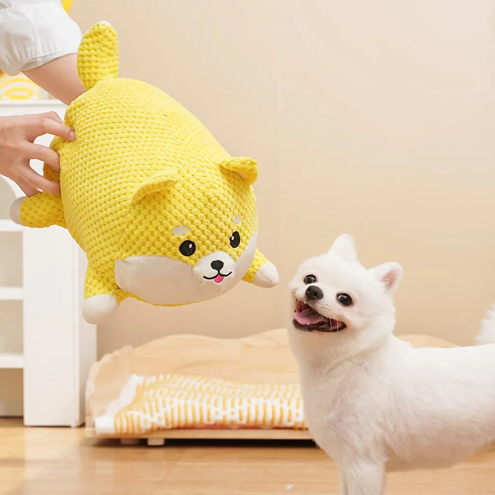Plush calming dog toy with pillow shape, textured surface, and squeakers inside
