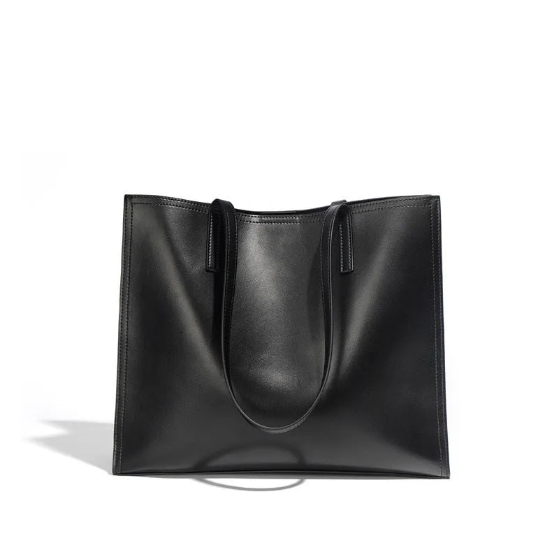 Genuine leather women's one shoulder handbag in a horizontal square shape showing internal compartments.