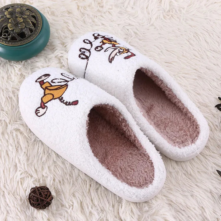 White cartoon pattern plush toe holder slippers with a non-slip rubber sole.
