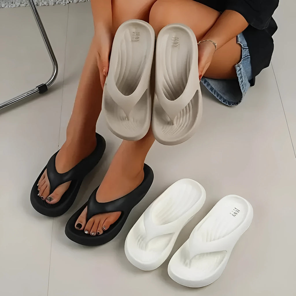 Women's thick-soled EVA flip-flops in black, white, or grey colours with non-slip and anti-odour properties