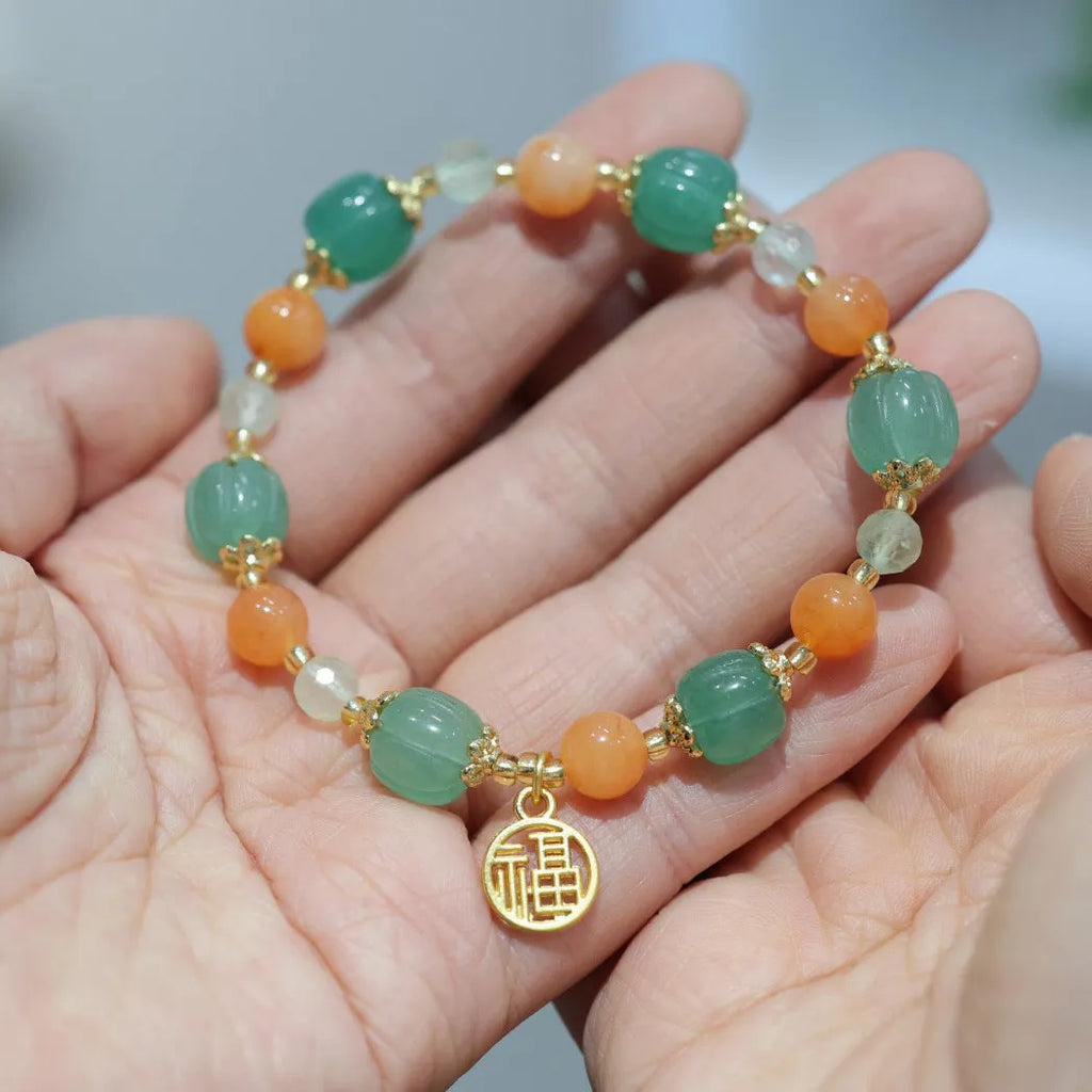 Women's Chinese style Duobao pumpkin bracelet made of Jinsi Jade and Prehnite beads.