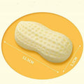 Yellow peanut-shaped dog chew toy with textured shell for teeth cleaning