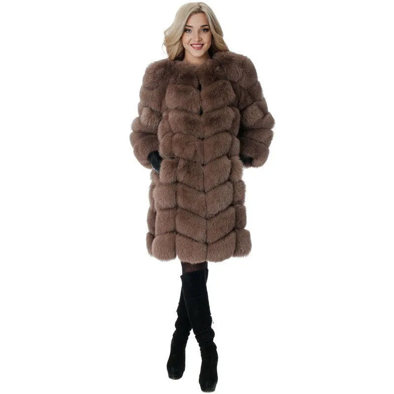 Women's long black faux fur coat with regular sleeves on a hanger.