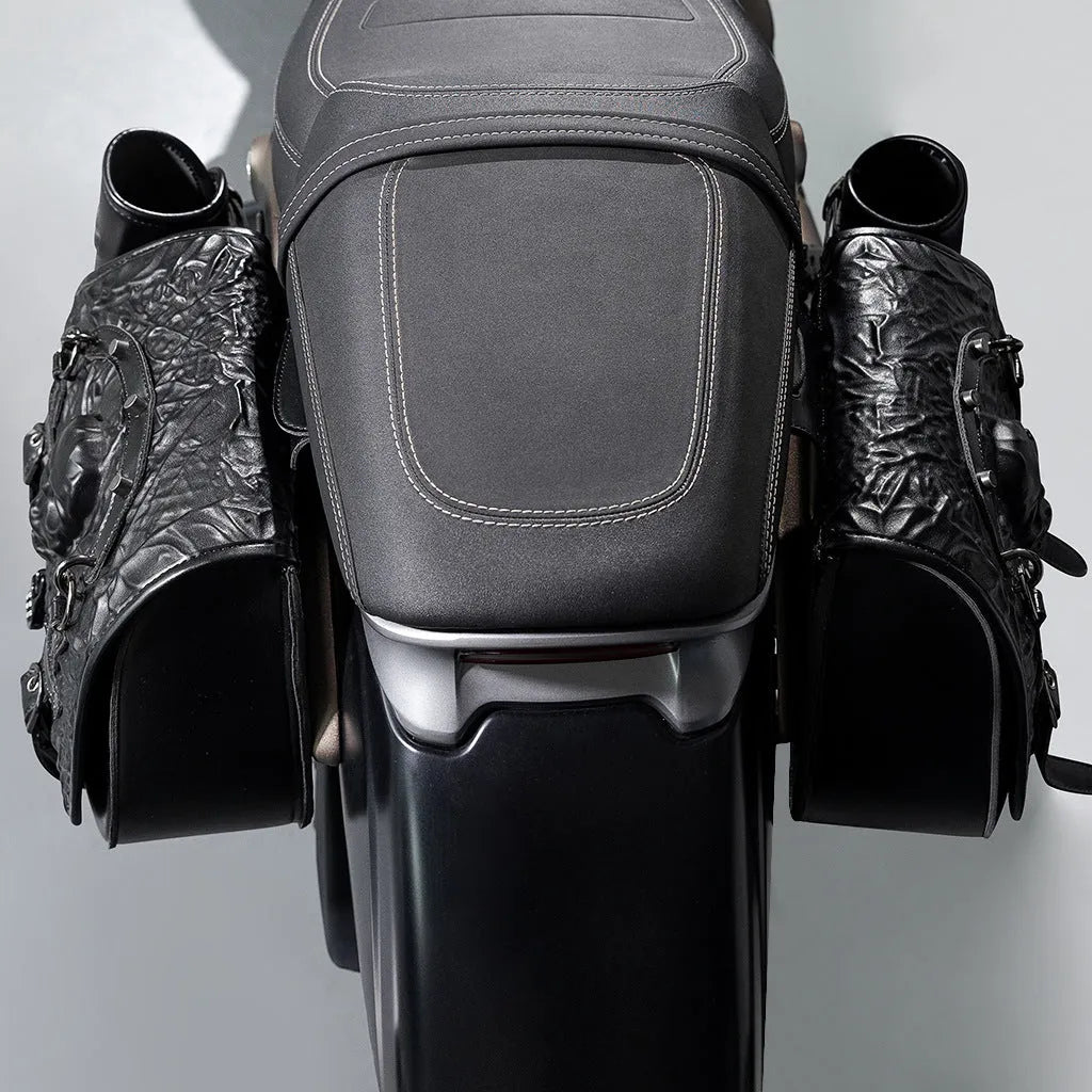 Pair of black PU synthetic leather motorcycle side luggage bags mounted on a modified bike frame.