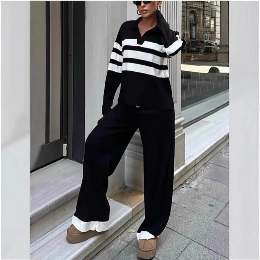 Women's black and white striped knitted polo collar two-piece set with long sleeves and trousers.