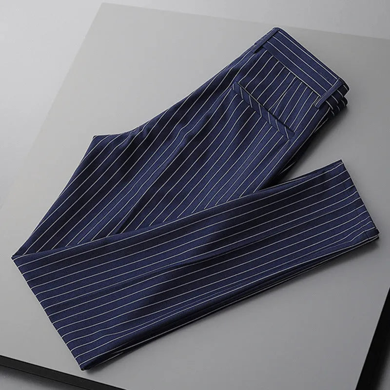 Men's loose draping suit pants in thin striped fabric showing trousers style and crop jeans cuts in black and white colours
