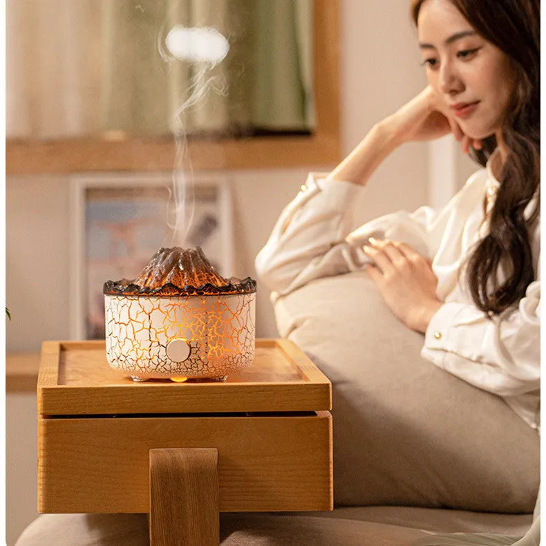 Column-shaped volcano humidifier emitting mist with colourful LED lights and remote control