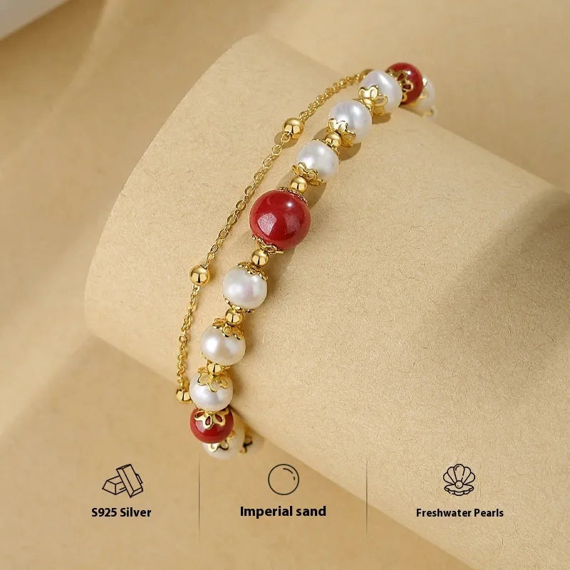 Sterling silver double-layer bracelet with white freshwater pearls and cinnabar red beans