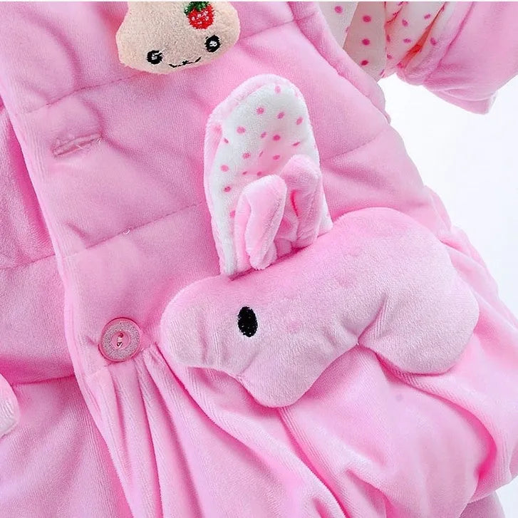 Girls' pink autumn winter three-piece clothing set with jacket, vest, and long trousers on a hanger.