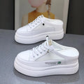 White women's platform shoes with mesh surface and heel-free design on rubber sole