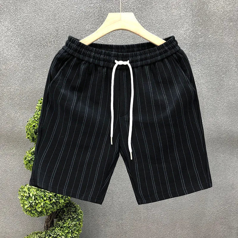 Men's black and white striped fleece-lined casual shorts with an elastic waistband