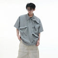 Men's black geometric print polo shirt with a deconstructed layered collar design.
