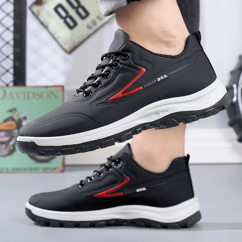 Black and red waterproof leisure shoes with soft plastic sole and lace-up front