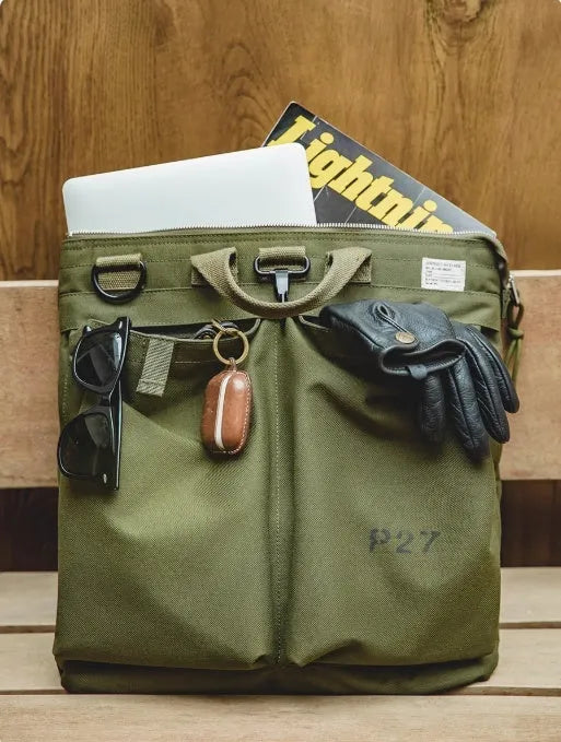 Canvas crossbody messenger bag in retro style with shoulder strap, showing internal phone pocket and 15-inch laptop capacity