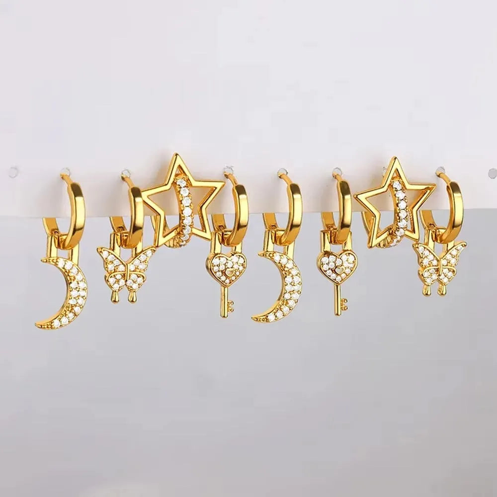 Women's geometric butterfly earrings in copper with heart and star details