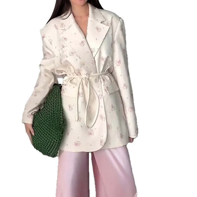 Polyester suit jacket with an adjustable lace-up collar at the waist, shown in a floral print colour option.