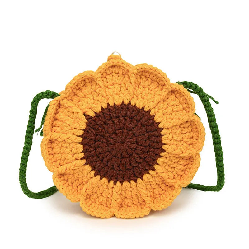 Hand-woven round bag with crocheted flowers showing cotton lining and mobile phone pouch