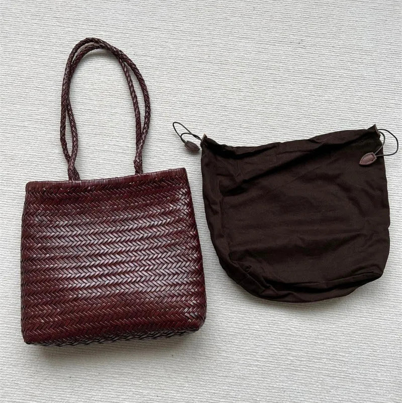 Handmade brown woven cowhide leather tote bag with a structured front pocket.