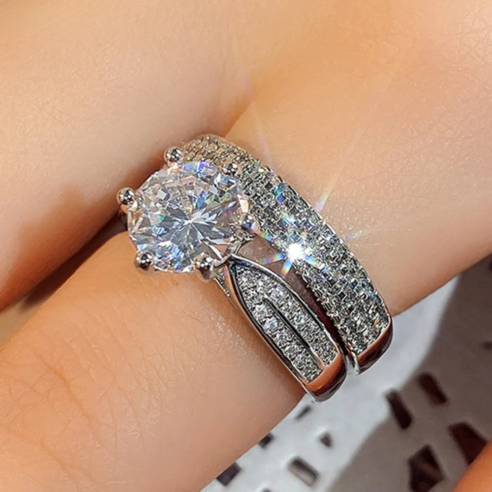 White gold colour alloy geometric wedding ring bracelet on a size chart.