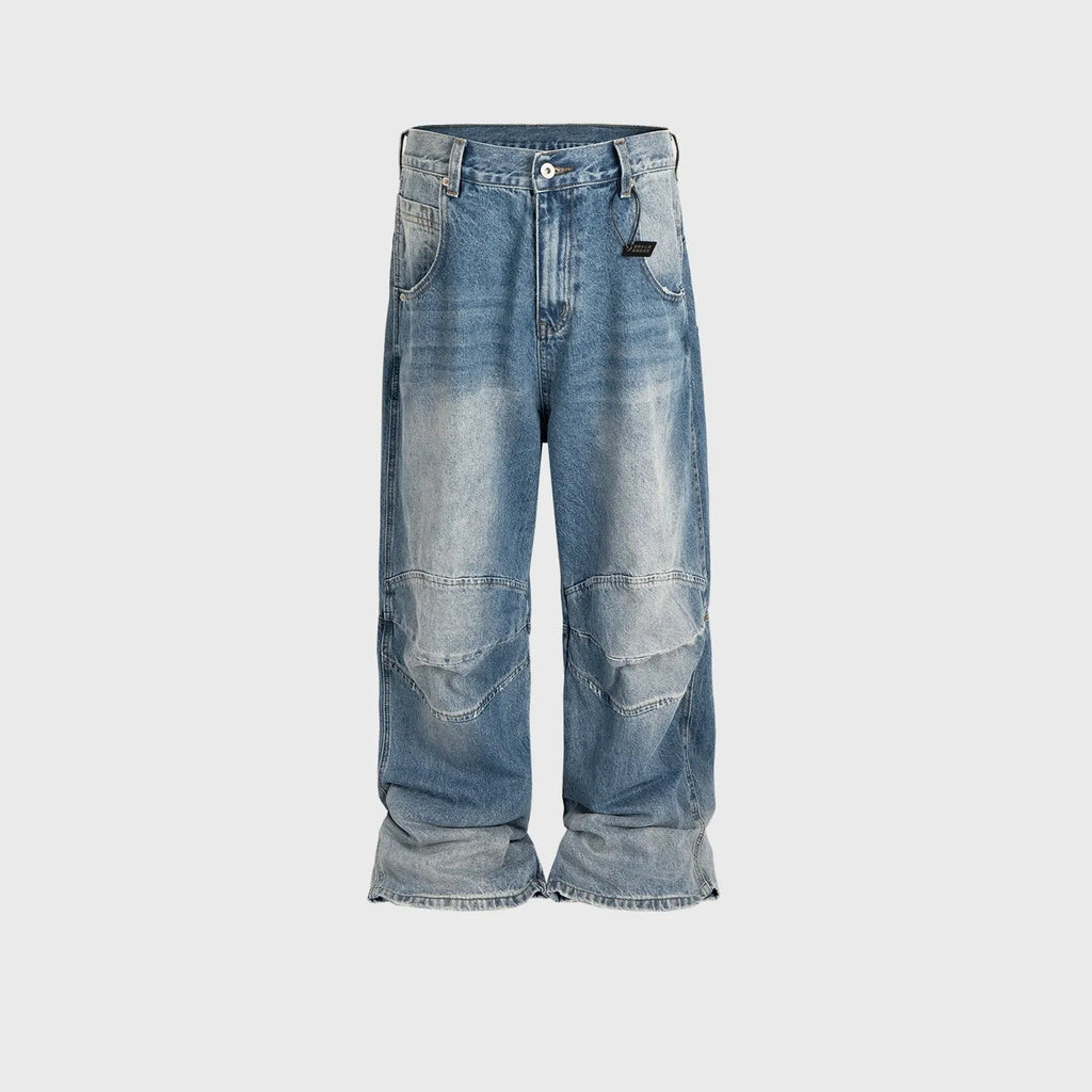 Blue baggy straight-leg jeans with a zip fly, shown in a washed white blue colour.