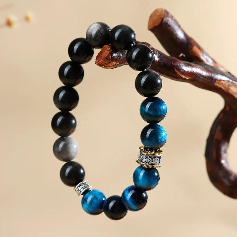Handmade peacock blue tigereye stone bracelet with geometric ethnic design and adjustable silver fastening