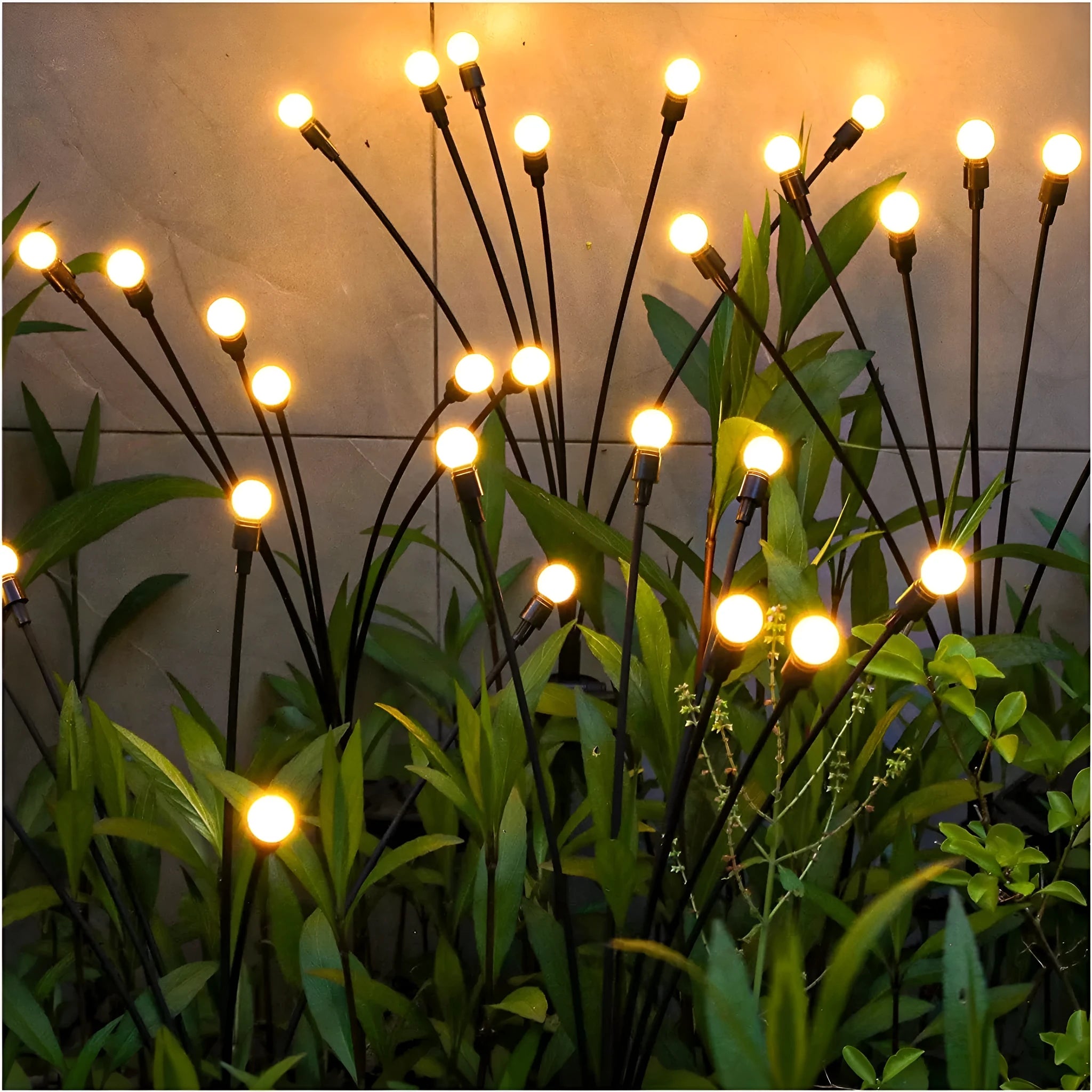 Set of solar-powered LED garden lights with ground spikes, showing firefly-style heads and solar panel.