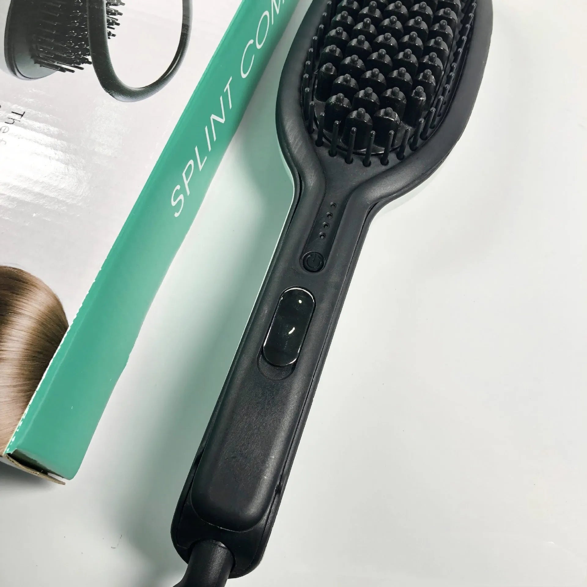 Explosive Style hair styler comb with tourmaline ceramic barrel, 10 heat settings, black and white finish