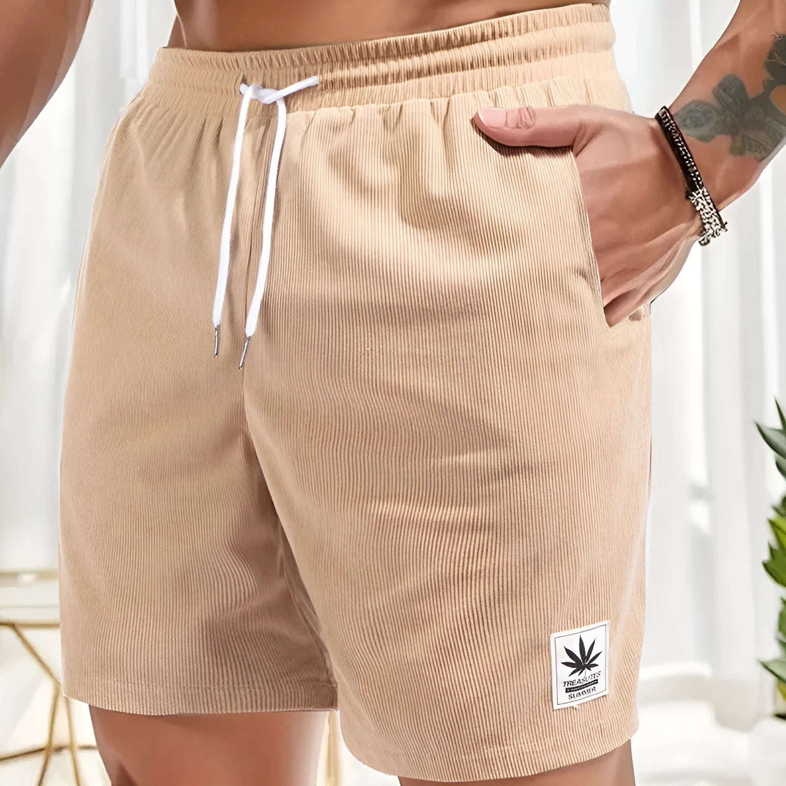 Man's drawstring waist summer shorts in blue, showing straight leg and casual fit