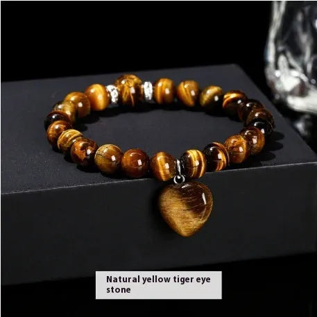 Handmade women's bracelet with geometric pendant and round natural crystal beads.