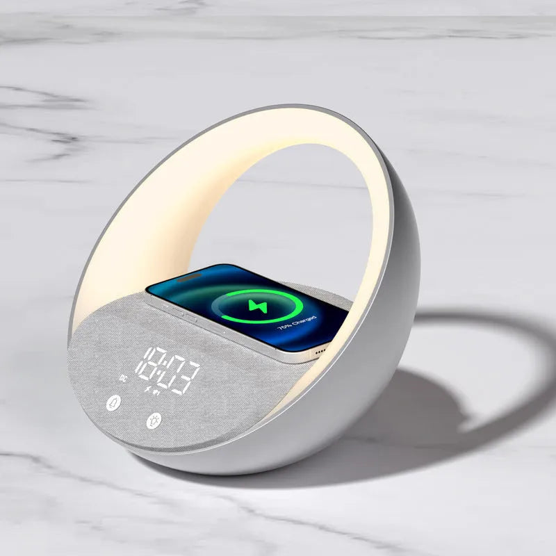 Beige multifunctional bedside unit with wireless charging pad, Bluetooth speaker, and LED light on a wooden table.