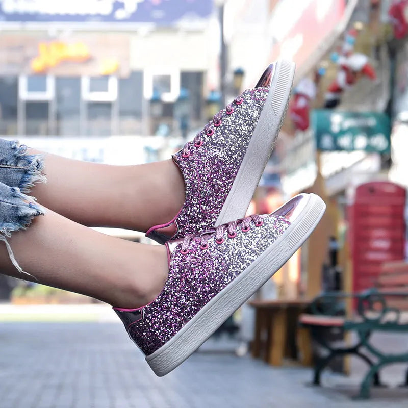 Women's black sequinned lace-up casual shoes with a round toe and rubber sole, shown from the side.