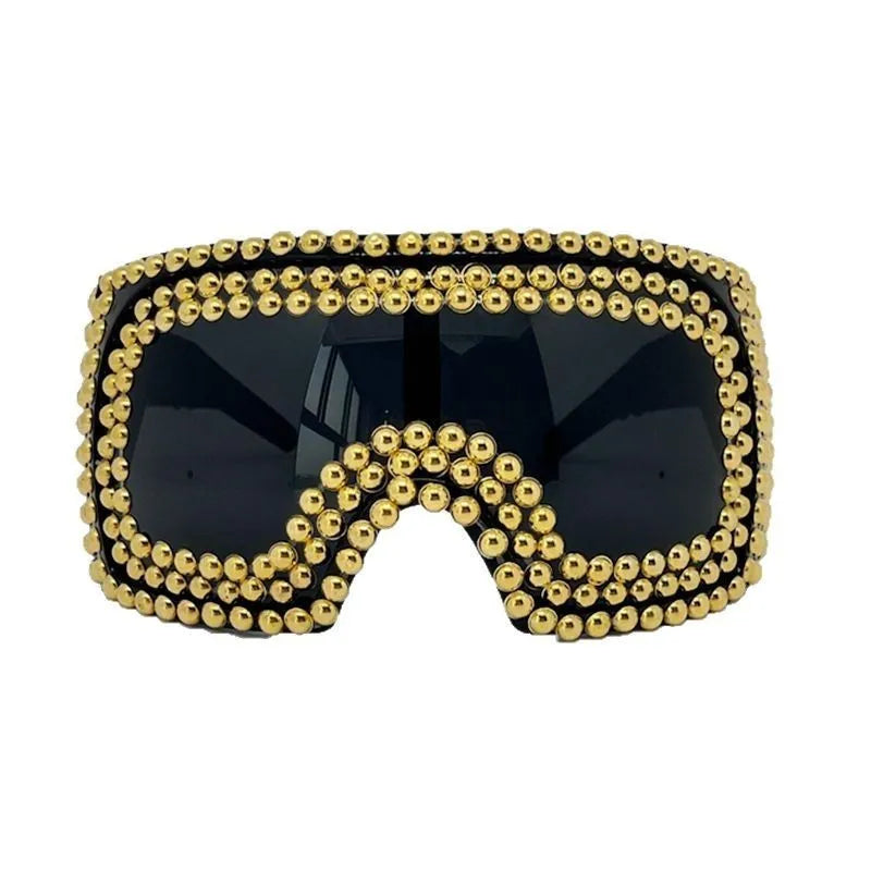 Men's punk style sunglasses with a large square frame and silver rivet details