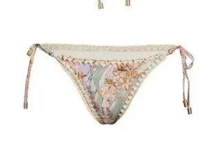 Women's creamy-white floral bikini set with matching skirt bottom