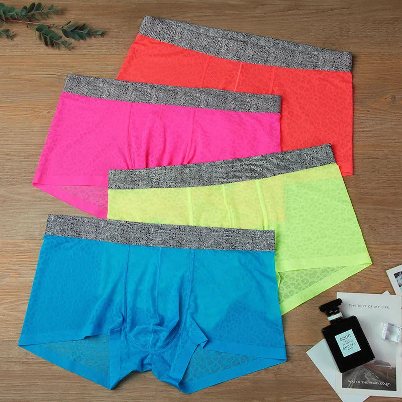 Man wearing seamless lace boxer briefs in a solid colour with low-waist design.