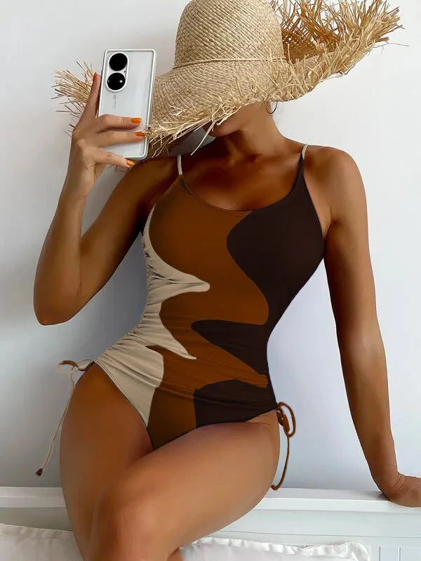 Women's sleeveless one-piece swimsuit in a choice of blue, purple, brown, or green colours.