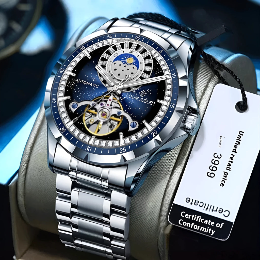 Men's silver automatic mechanical watch with blue dial and stainless steel bracelet on wrist.