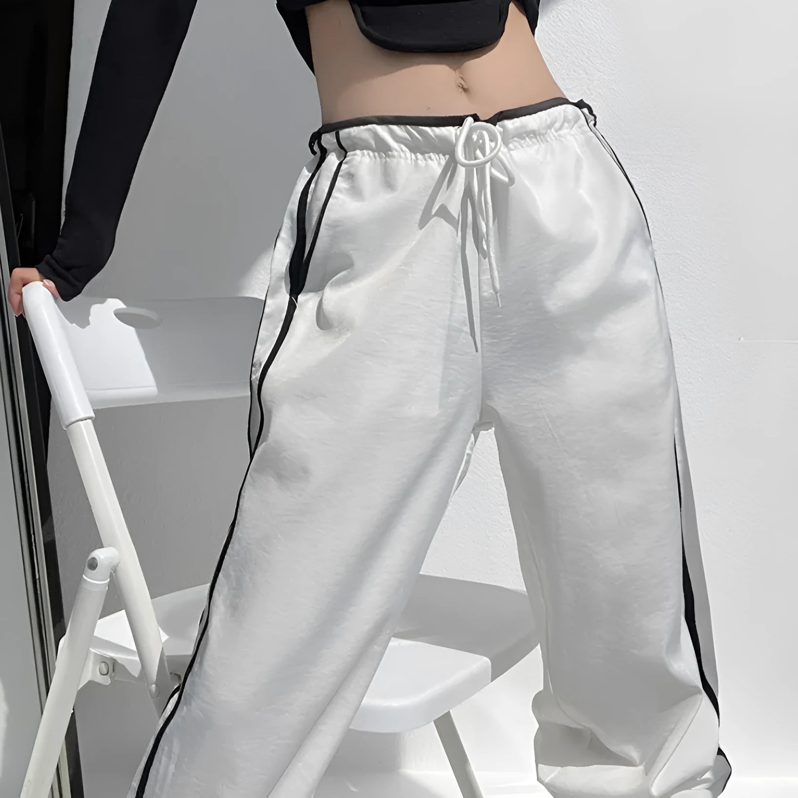 Women's navy blue loose straight pants with white contrast ribbon parallel bars detail and low waist