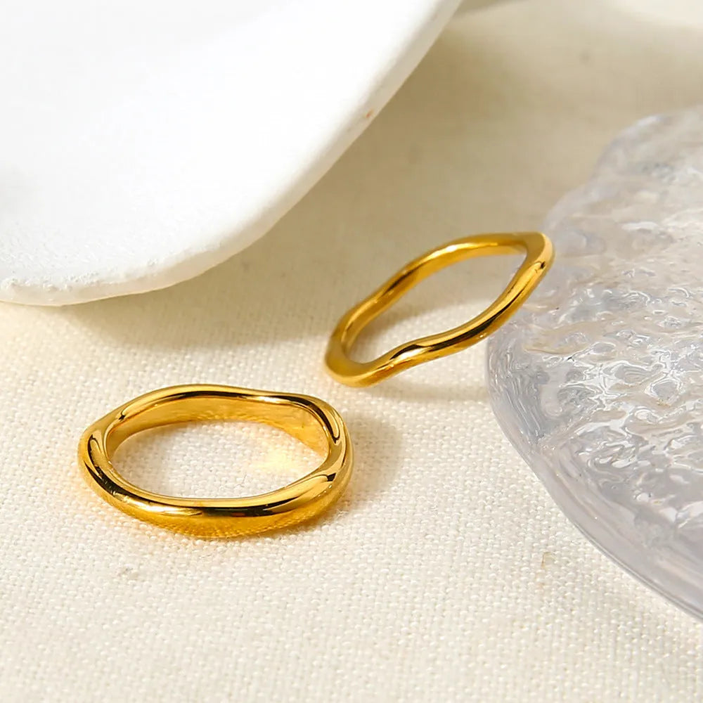 Stainless steel irregular wave ring with electroplated colour finish on hand