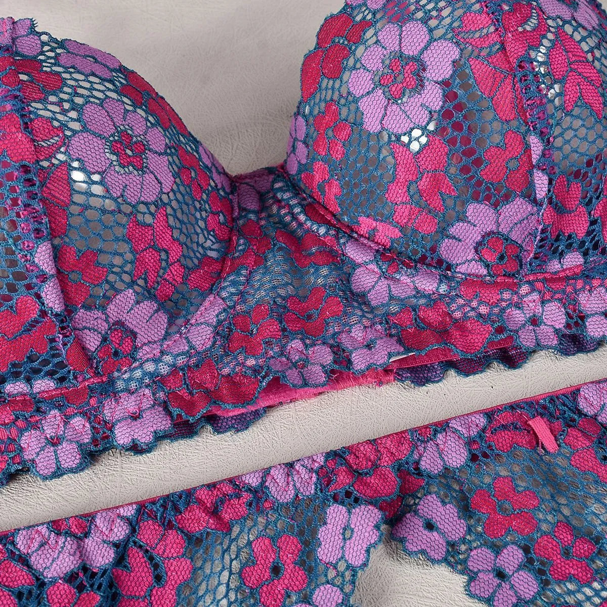 Women's rose red embroidered bikini set with contrast colour design on polyester fabric