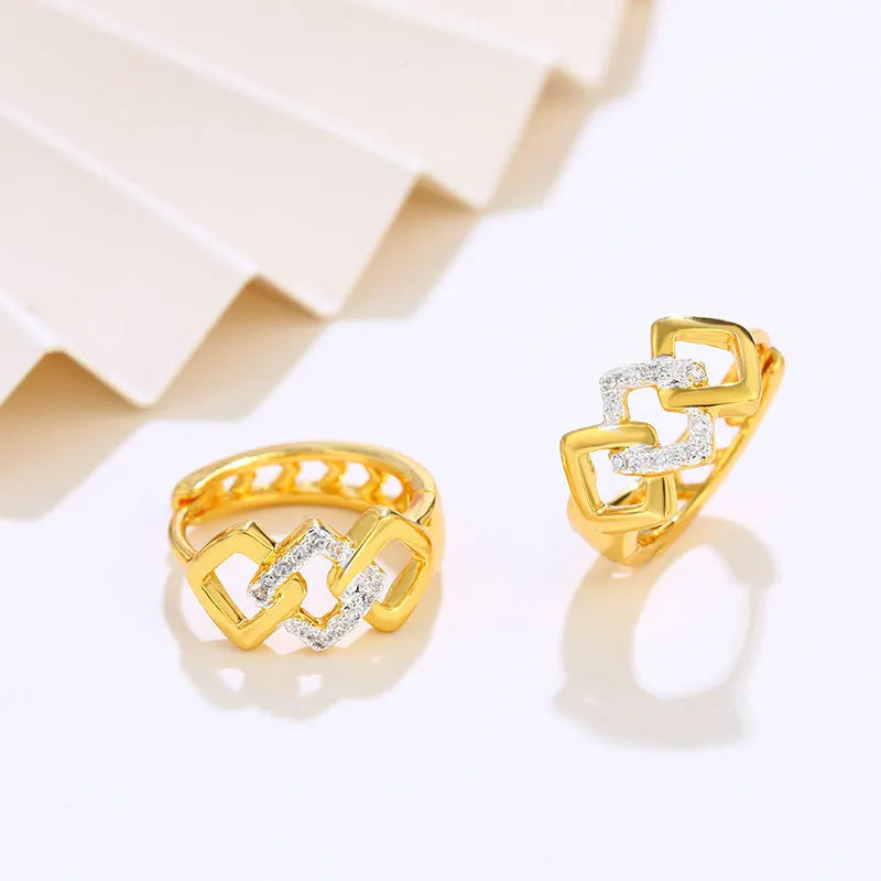 Gold tone geometric hollow-out drop earrings with colour separation clip design