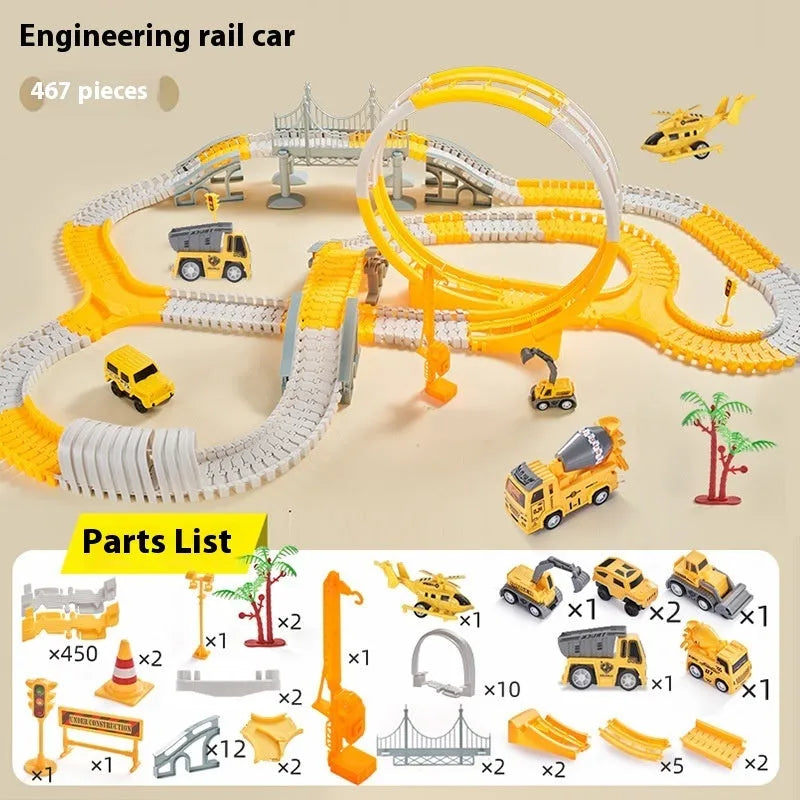 Rail car toy set with plastic track pieces and two electric vehicles in sliding layout