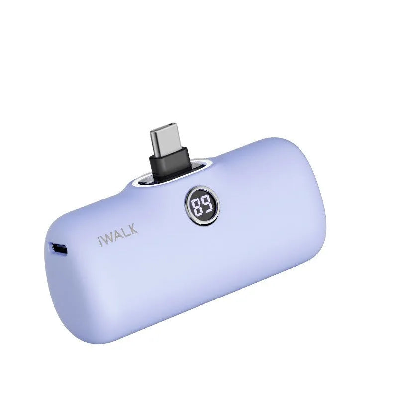 Compact white lipstick-shaped power bank showing screen display and charging port.