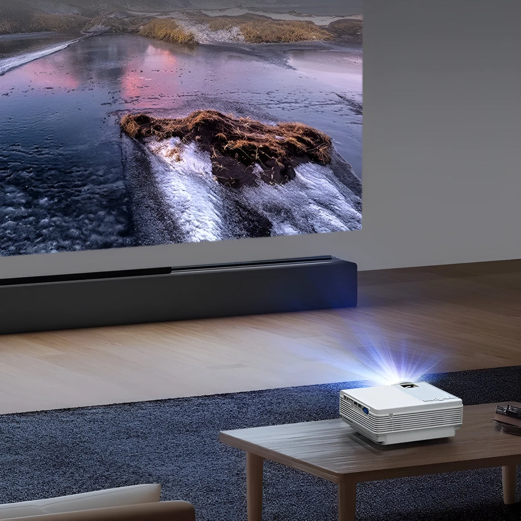 Portable HD 1080p projector in white with remote control, placed on a tabletop