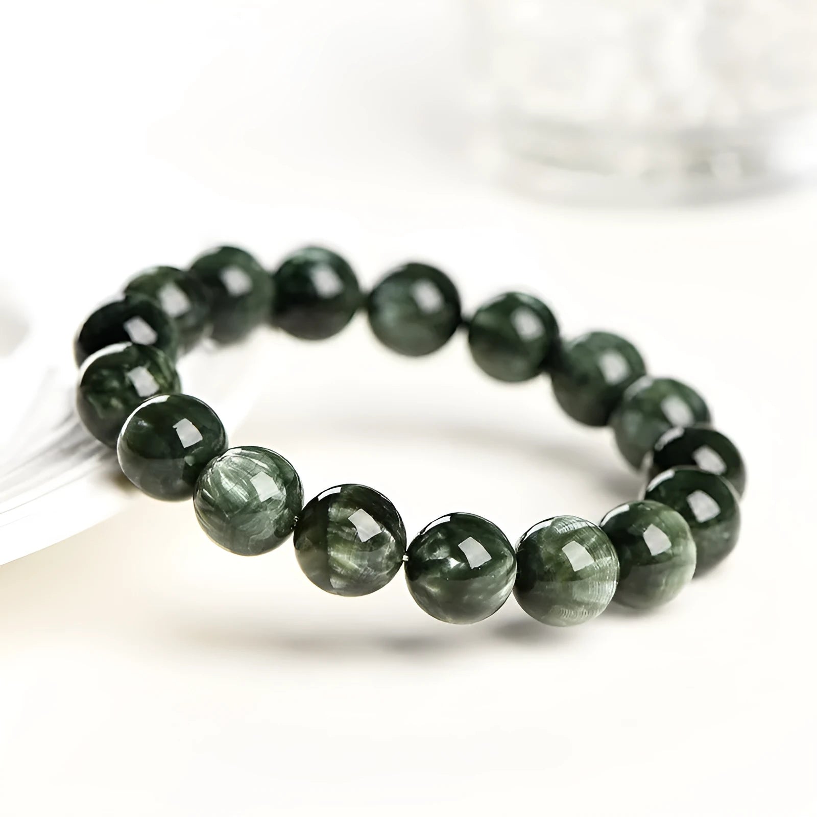 Green Dragon Crystal bracelet with 8-9mm geometric round beads and Ruyi design.
