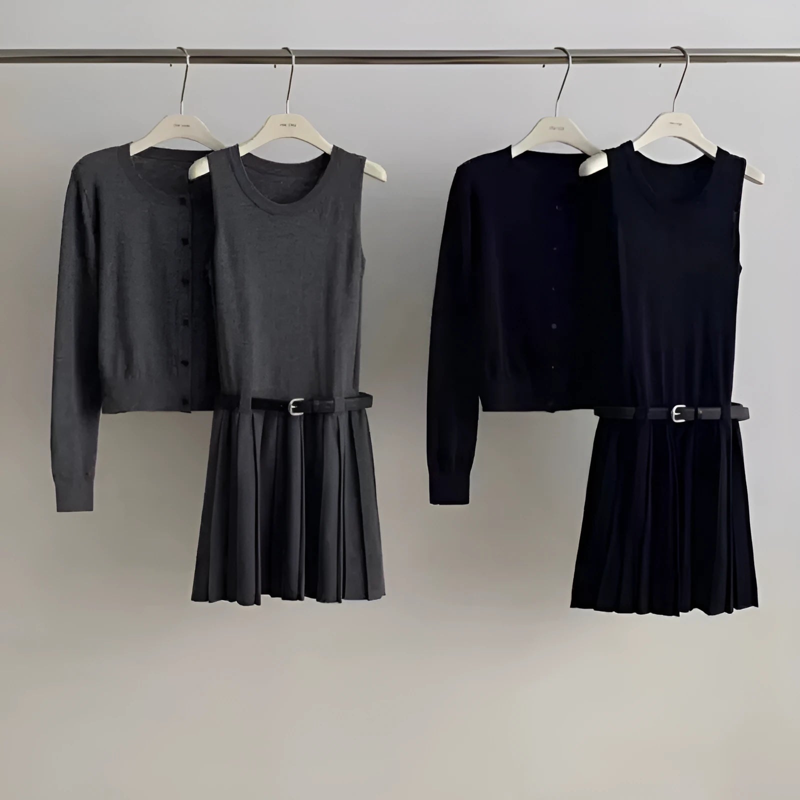 Grey Art Retro style women's knitted vest skirt and long-sleeved cardigan two-piece set with a 3D pattern.