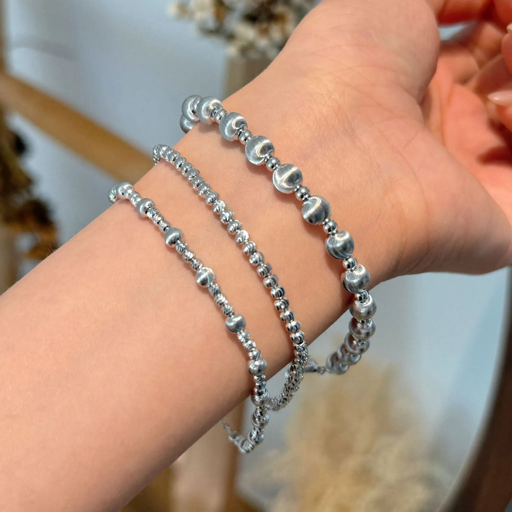 925 sterling silver carven design cat's eye brushed ball bracelet on white background
