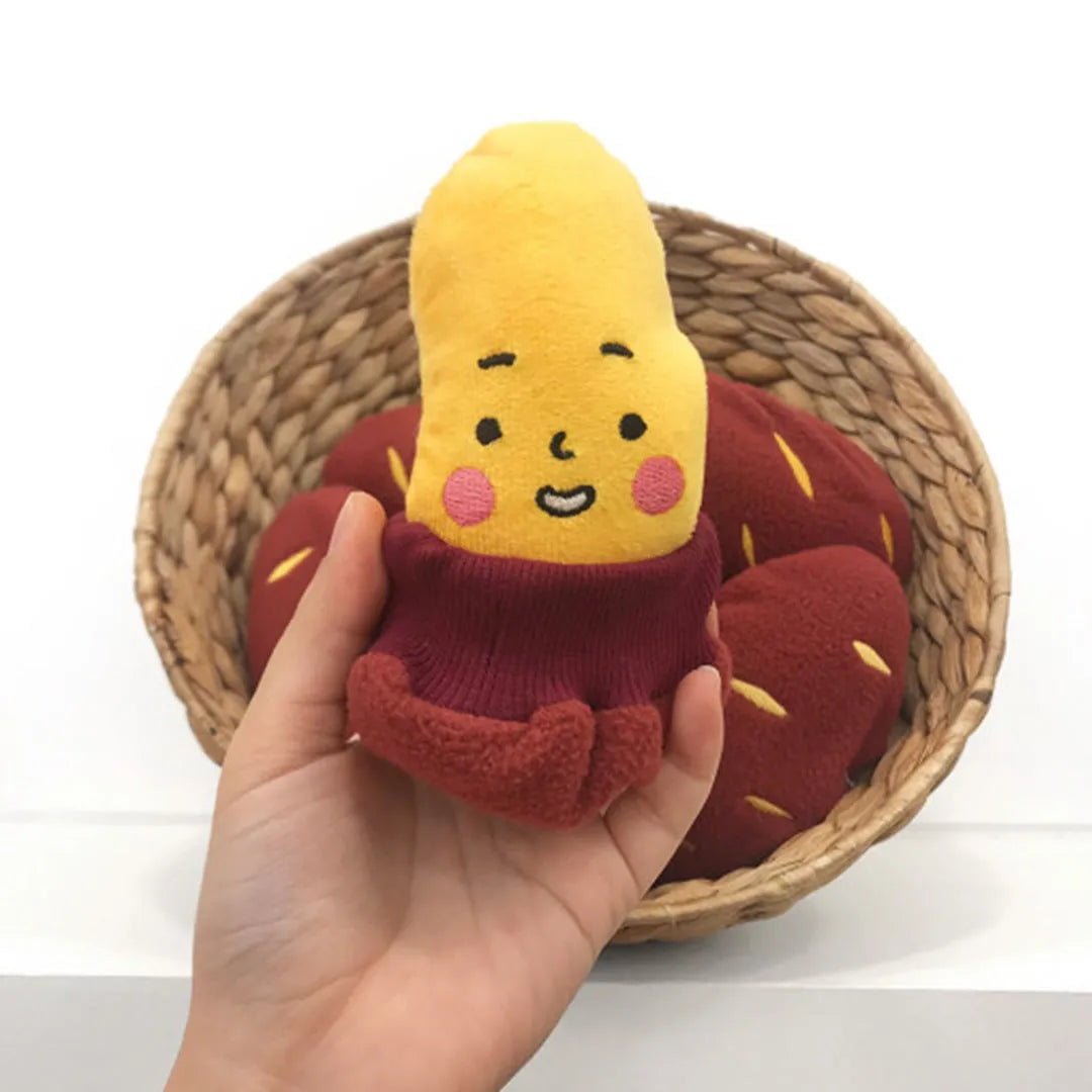 Red sweet potato-shaped dog puzzle toy with peel-open design revealing hidden treat compartments