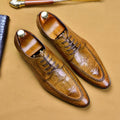 Men's black leather oxford shoes with a horse bit buckle and pointed toe on a rubber sole.