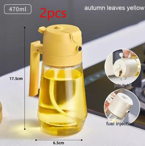 Glass olive oil sprayer bottle with ergonomic handle in beige, showing spray and pour functions.